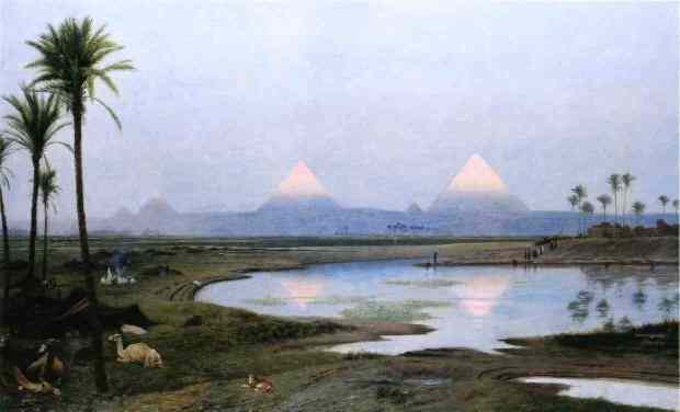 From across the Nile the tips of the Pyramids glow brightly, while the remainder is veiled in mist.